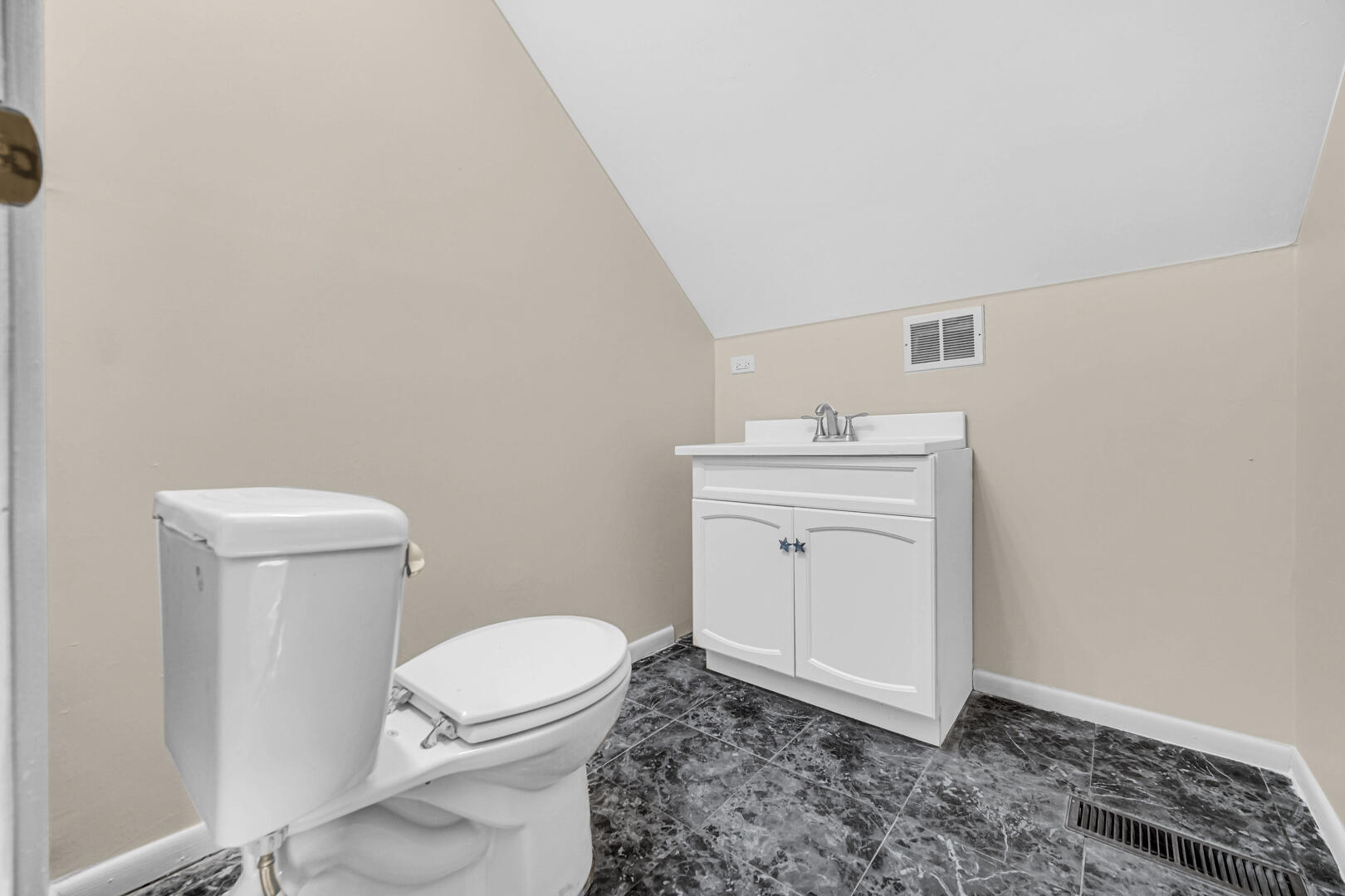 769-1 Juniper Road Valparaiso, IN 46385 - Photo 16 of 20 a bathroom with a sink a toilet and mirror