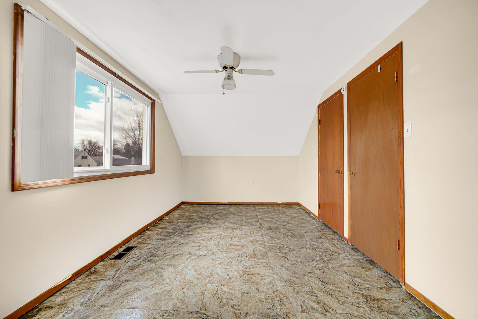 769-1 Juniper Road Valparaiso, IN 46385 - Photo 18 of 20 an empty room with windows and ceiling fan
