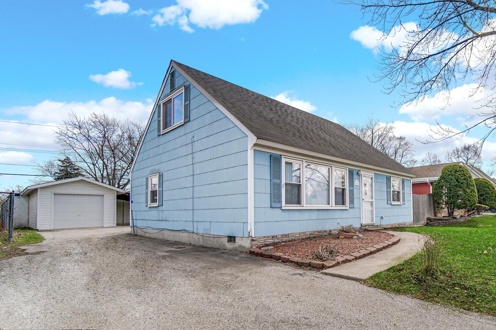 769-1 Juniper Road Valparaiso, IN 46385 - Photo 3 of 20 a view of a house with a yard and garage