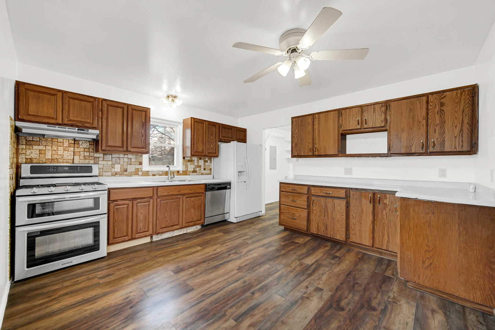 769-1 Juniper Road Valparaiso, IN 46385 - Photo 10 of 20 a kitchen with wooden floors and white cabinets