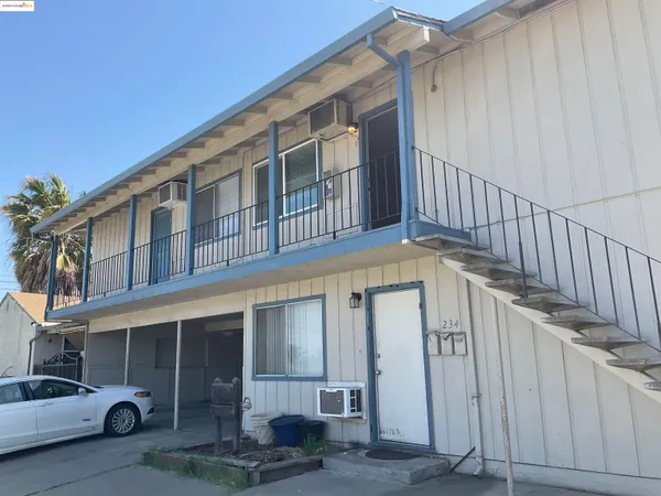 a view of a house with a small yard