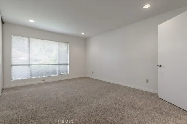 a bathroom with a sink vanity granite and toilet
