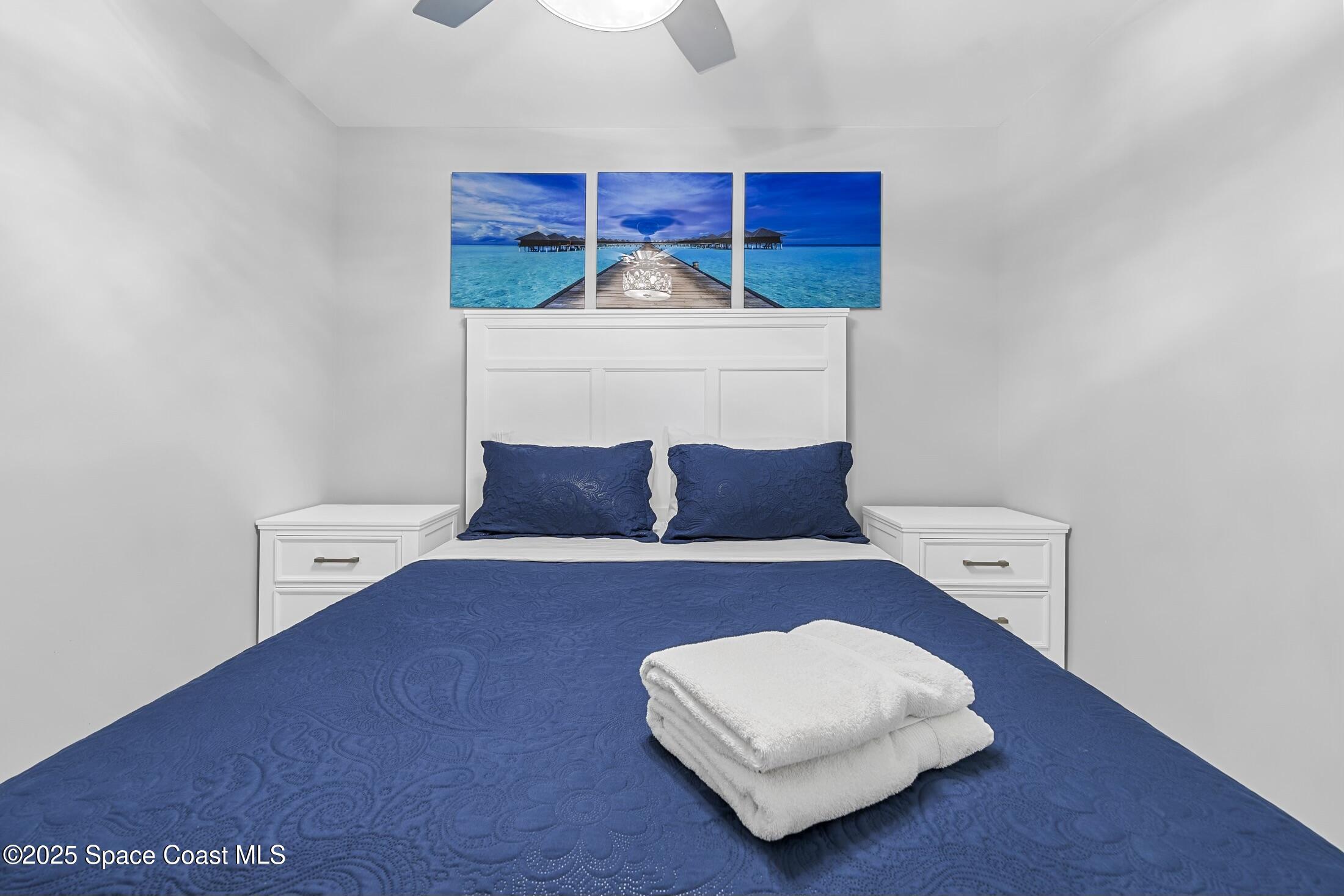 236 Northeast 3rd Street Satellite Beach, FL 32937 - Photo 12 of 22 a living room with furniture and a lamp