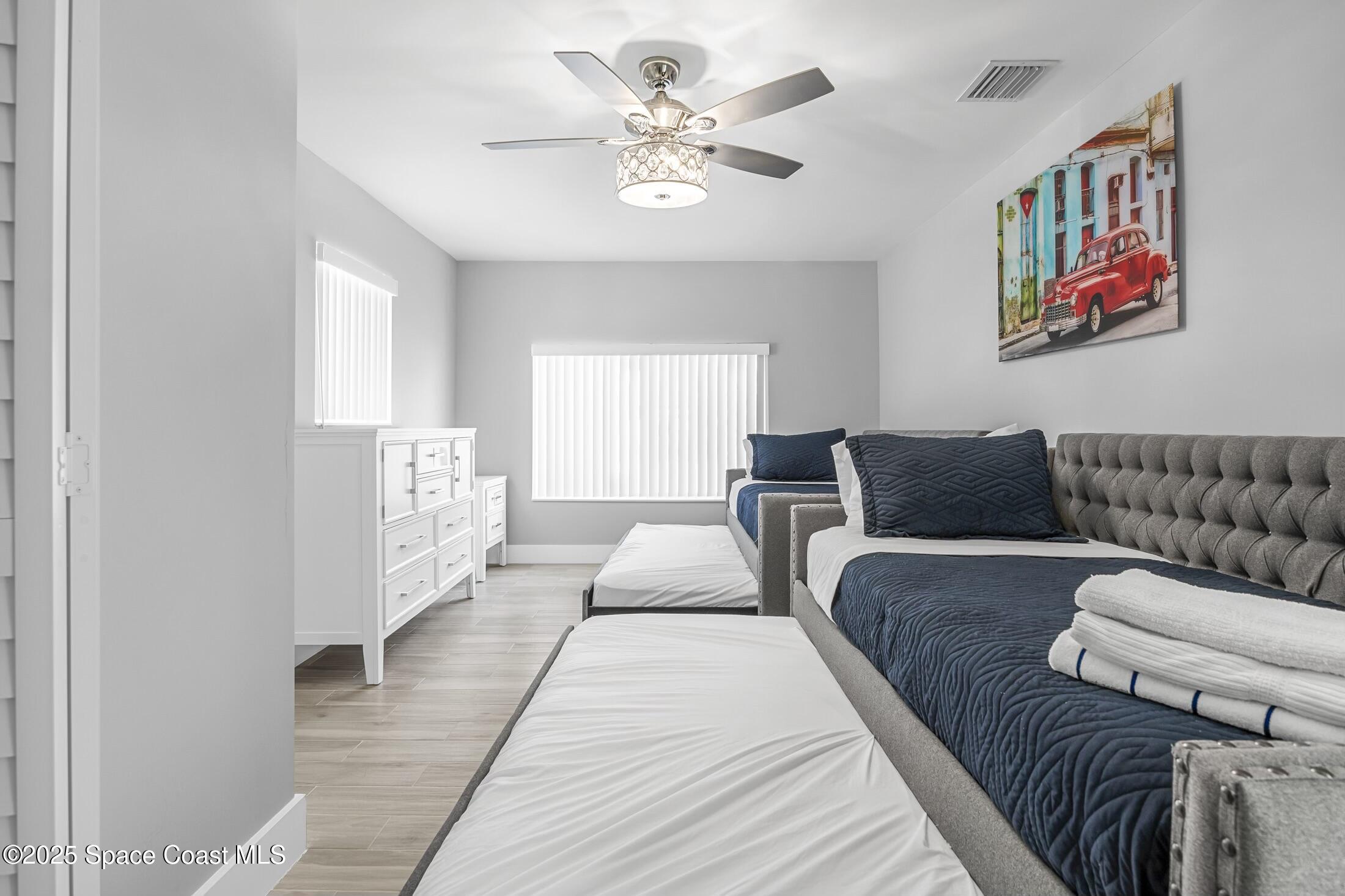 236 Northeast 3rd Street Satellite Beach, FL 32937 - Photo 18 of 22 a living room with furniture and a chandelier