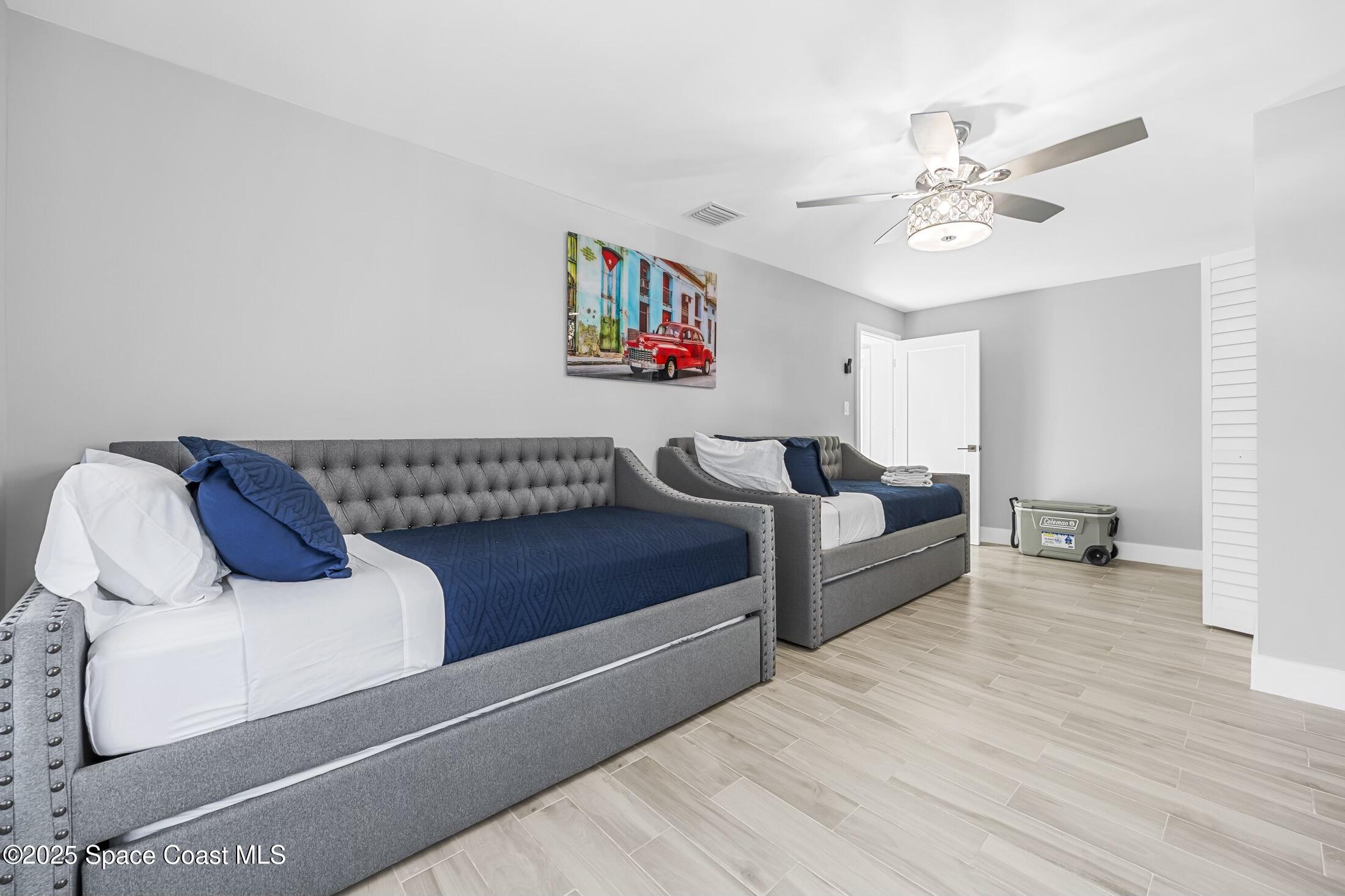 236 Northeast 3rd Street Satellite Beach, FL 32937 - Photo 19 of 22 a living room with furniture and a wooden floor
