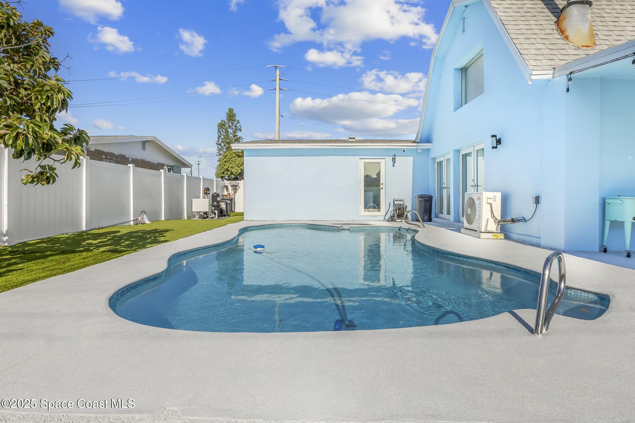 236 Northeast 3rd Street Satellite Beach, FL 32937 - Photo 20 of 22 a view of a living room with kitchen