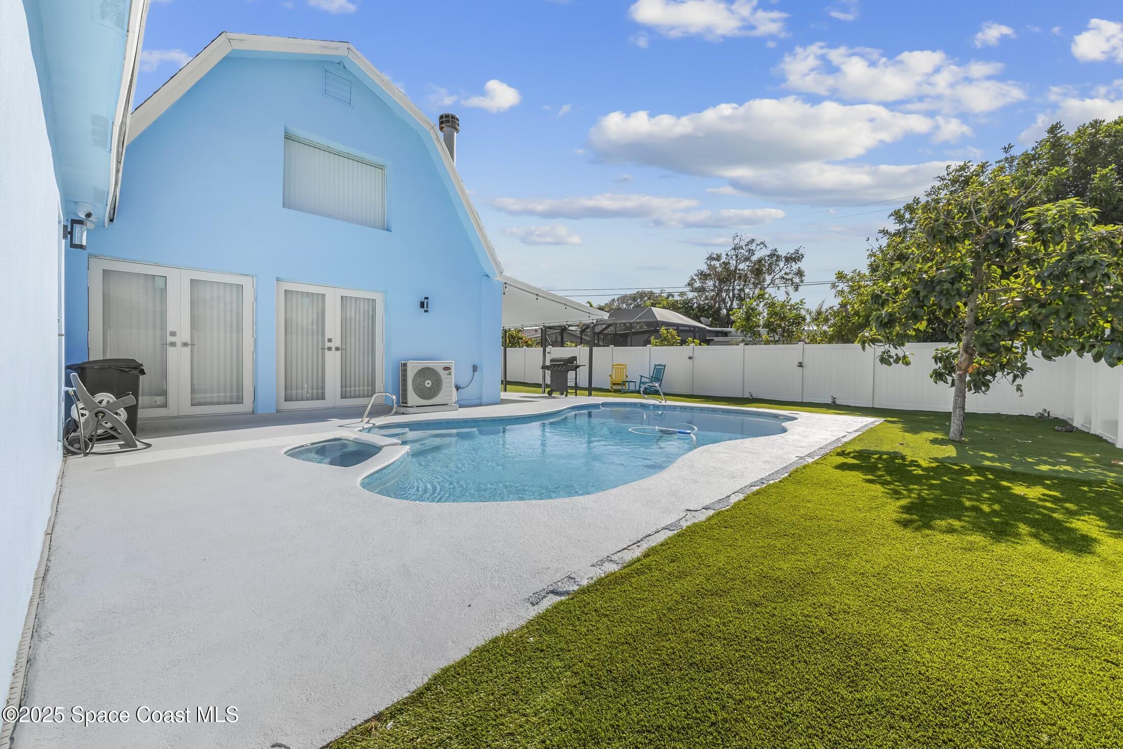 236 Northeast 3rd Street Satellite Beach, FL 32937 - Photo 21 of 22 a view of a swimming pool with a yard