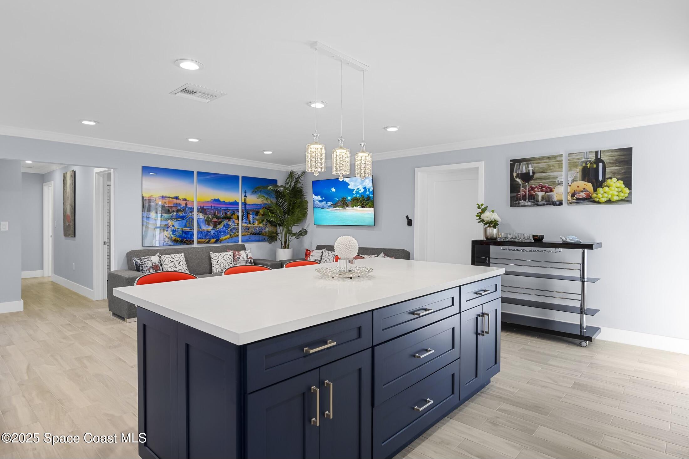 236 Northeast 3rd Street Satellite Beach, FL 32937 - Photo 8 of 22 a view of kitchen with stainless steel appliances kitchen island a large island in the center