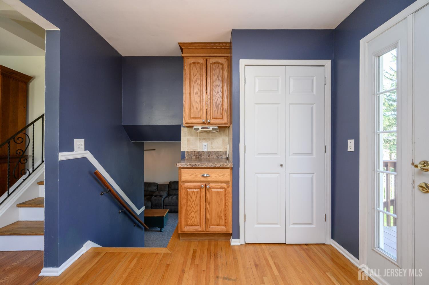 37 Helena Street East Brunswick, NJ 08816 - Photo 12 of 41 a view of a hallway with wooden floor and staircase