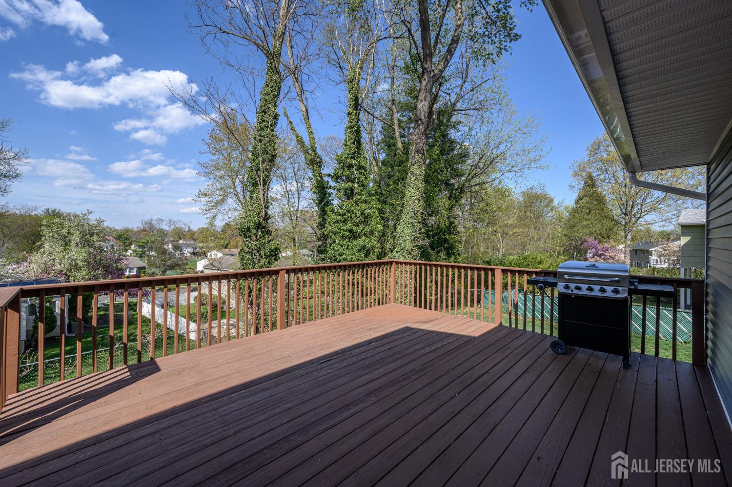 37 Helena Street East Brunswick, NJ 08816 - Photo 27 of 41 a view of balcony with wooden floor and fence
