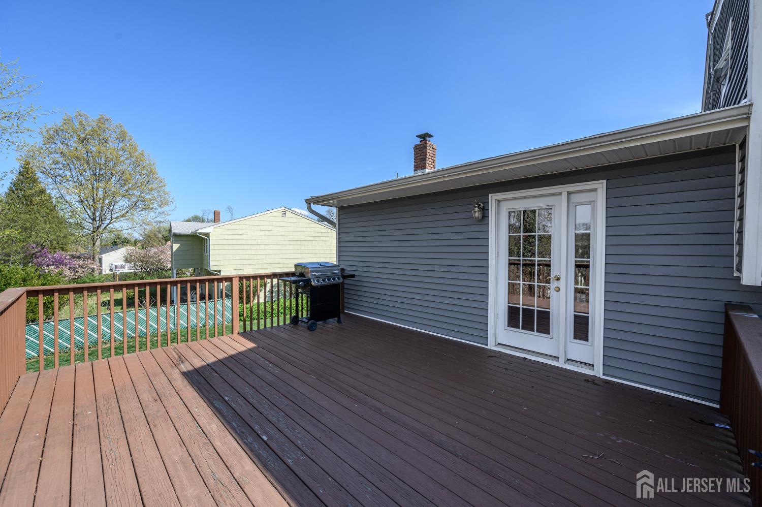 37 Helena Street East Brunswick, NJ 08816 - Photo 30 of 41 a view of a roof deck with wooden floor and fence with a yard