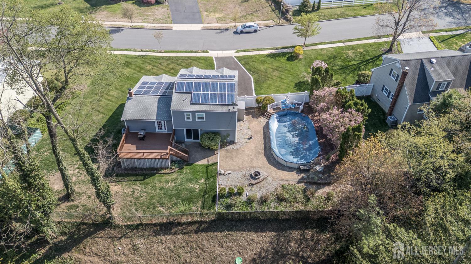 37 Helena Street East Brunswick, NJ 08816 - Photo 38 of 41 a aerial view of a house with a yard and large tree