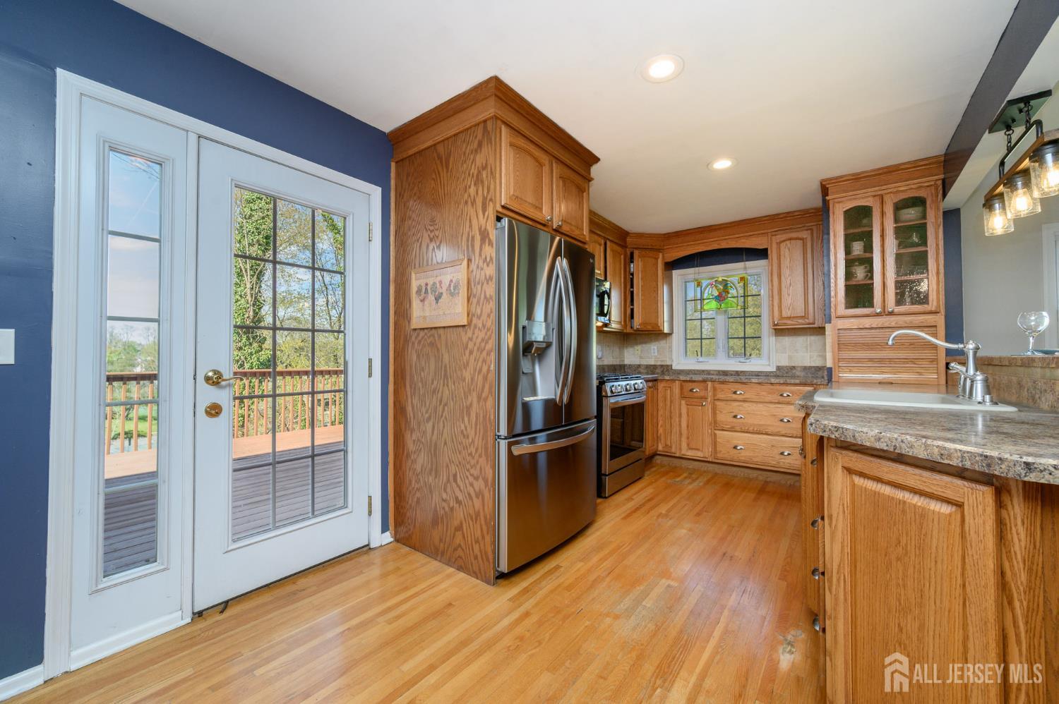 37 Helena Street East Brunswick, NJ 08816 - Photo 9 of 41 a kitchen with stainless steel appliances granite countertop a refrigerator a sink and wooden cabinets