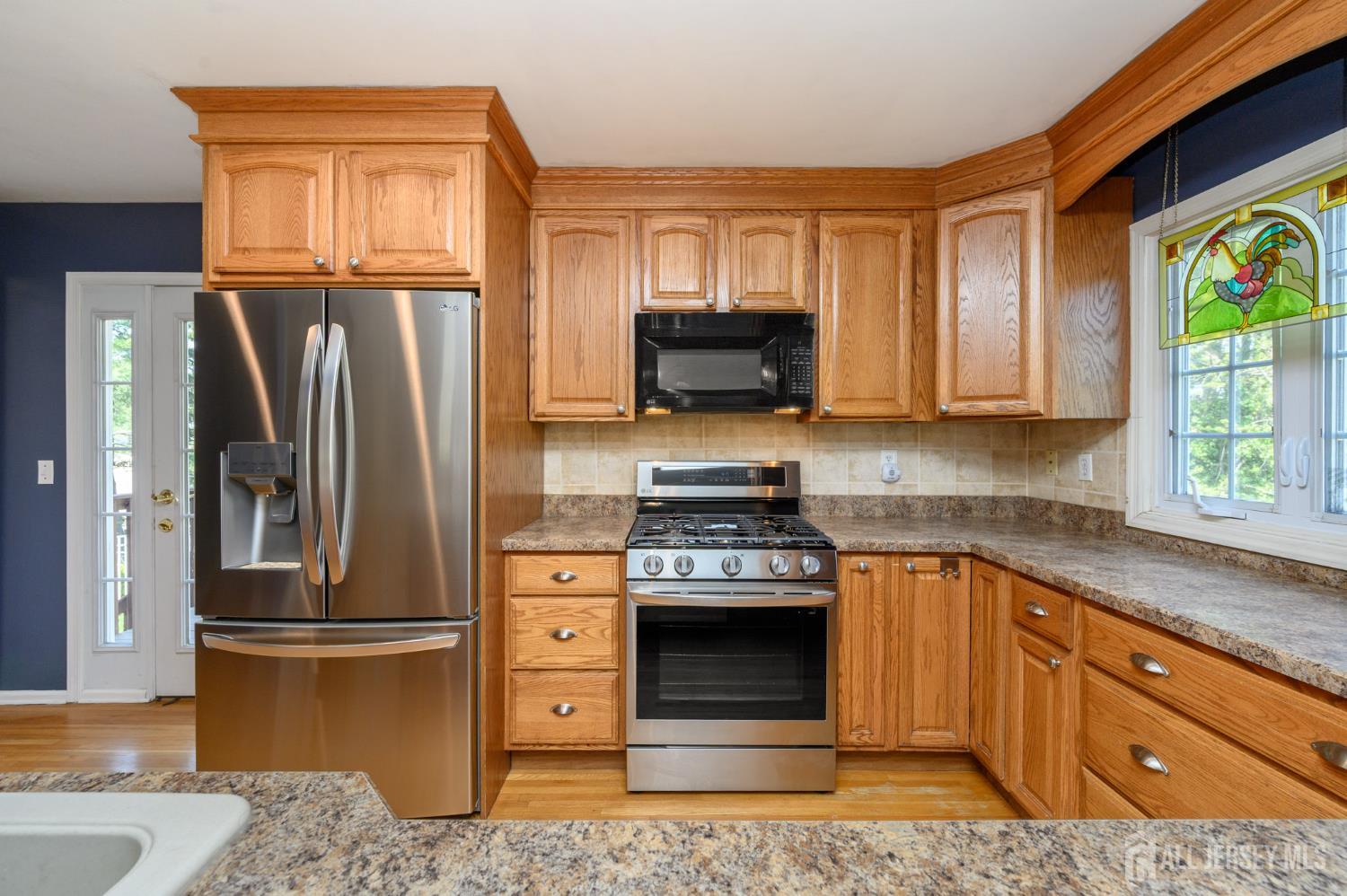 37 Helena Street East Brunswick, NJ 08816 - Photo 10 of 41 a kitchen with granite countertop a refrigerator stove and oven