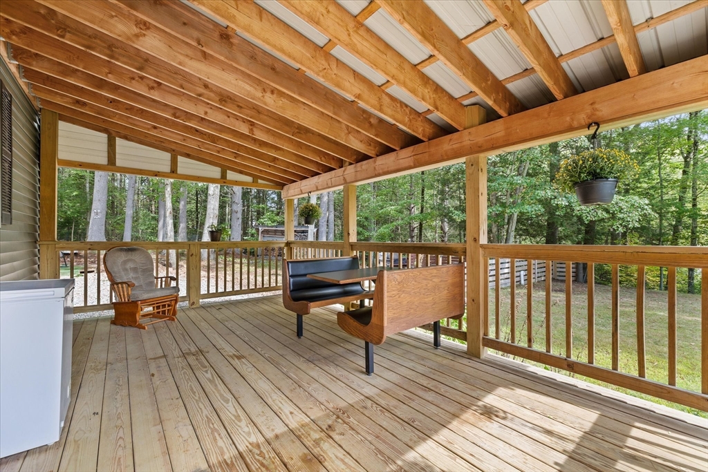 7 First Street Templeton, MA 01468 - Photo 4 of 35 a balcony with wooden floor outdoor seating and yard