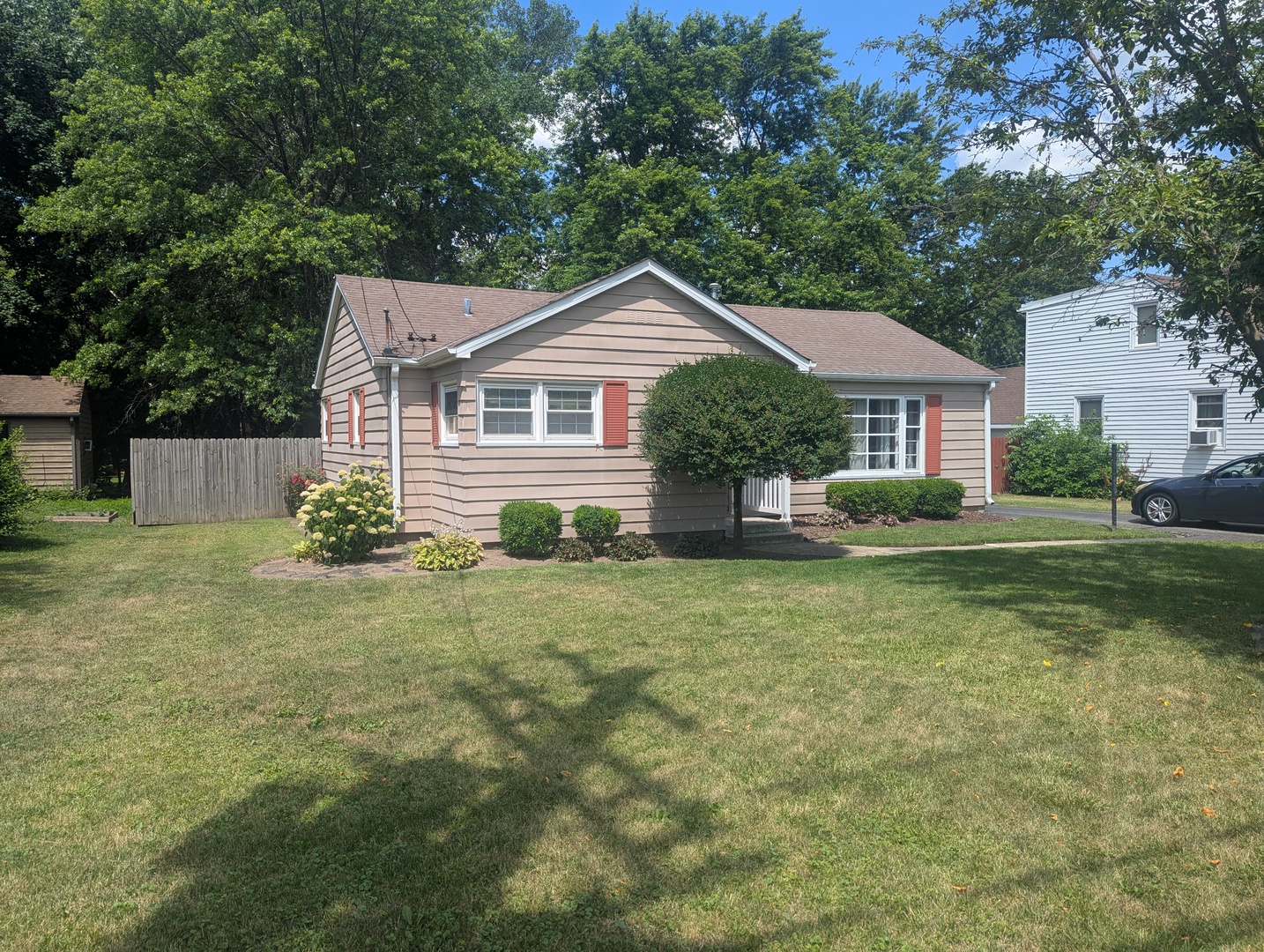 515 South Cedar Road New Lenox, IL 60451 - Photo 2 of 19 a front view of a house with a yard and trees