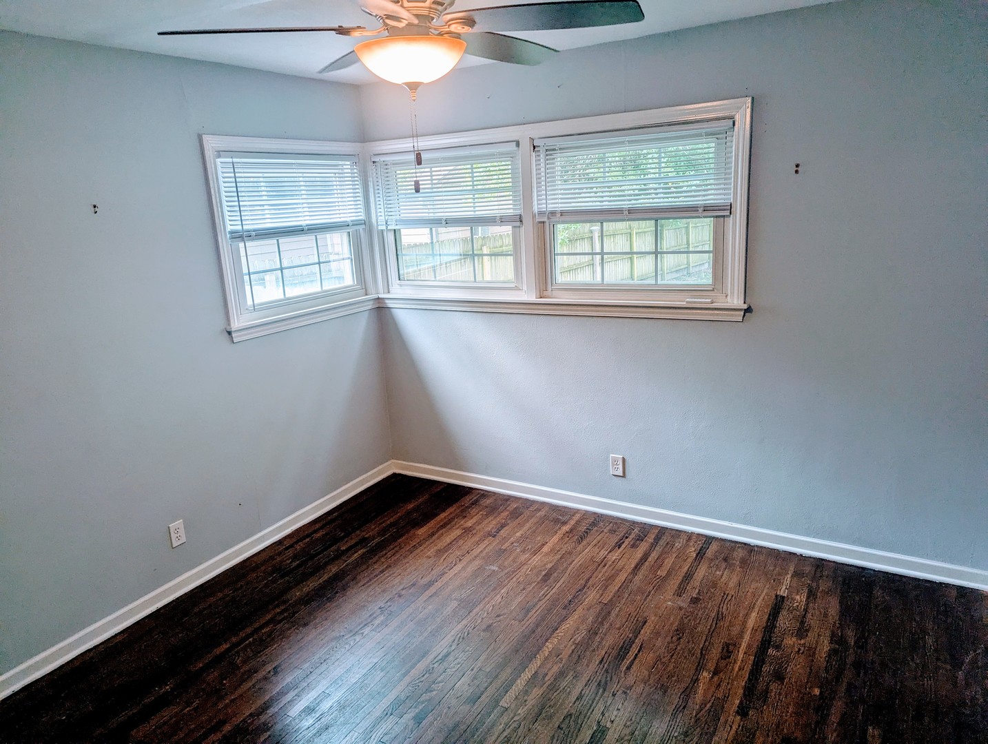 515 South Cedar Road New Lenox, IL 60451 - Photo 9 of 19 an empty room with wooden floor and windows