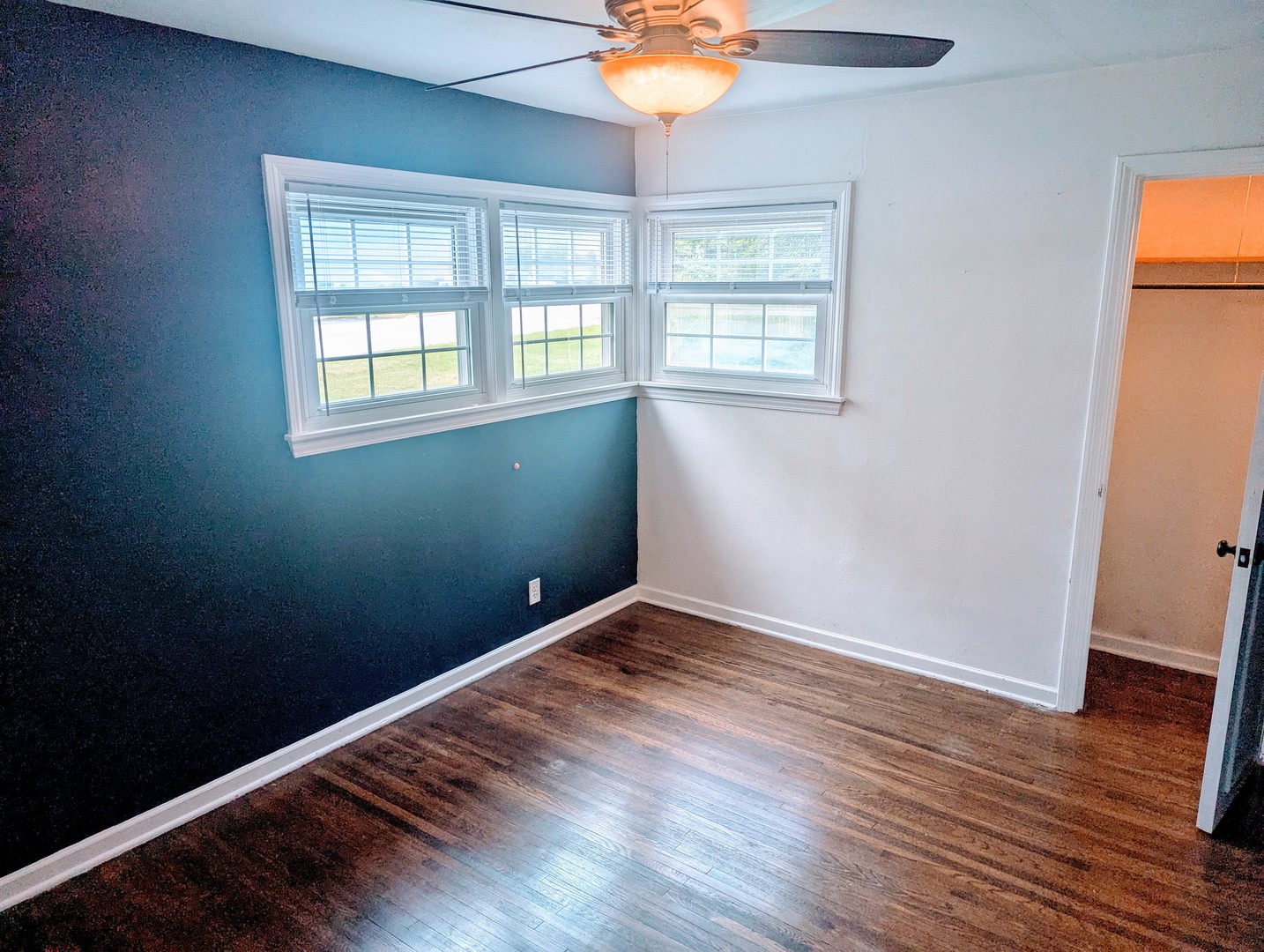 515 South Cedar Road New Lenox, IL 60451 - Photo 10 of 19 an empty room with wooden floor and windows