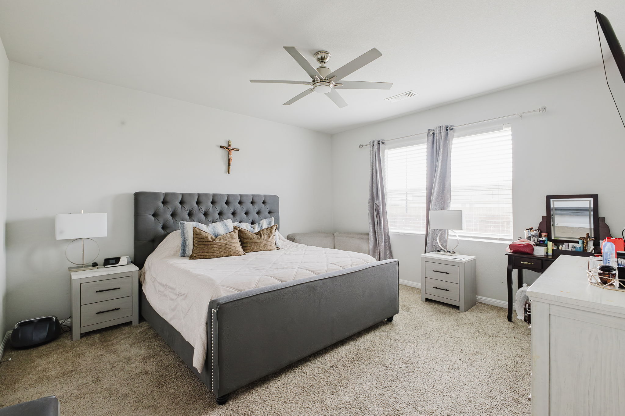 307 Watercourse Way Bastrop, TX 78602 - Photo 12 of 35 a bedroom with a bed and a large window