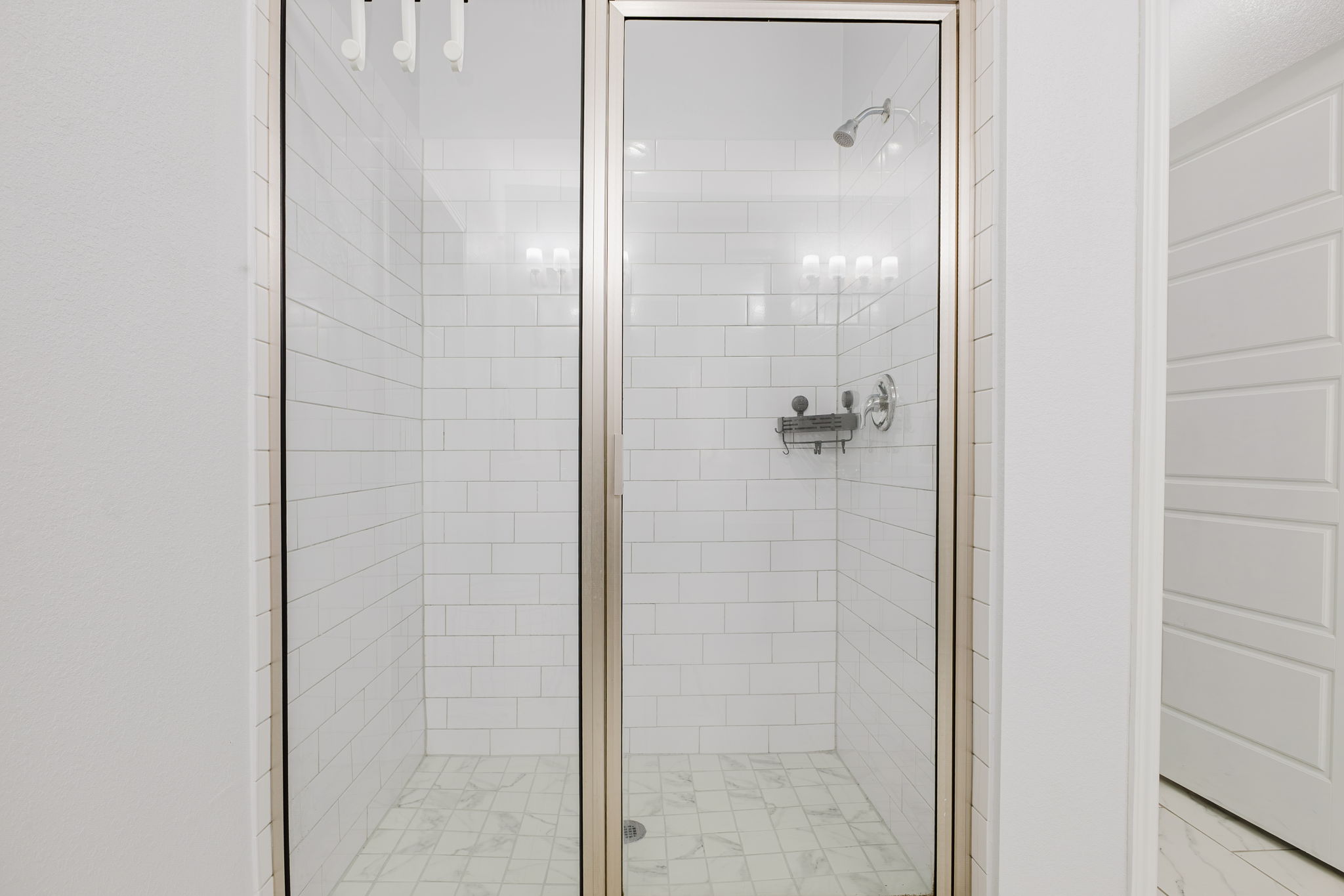 307 Watercourse Way Bastrop, TX 78602 - Photo 16 of 35 a bathroom with a glass shower door