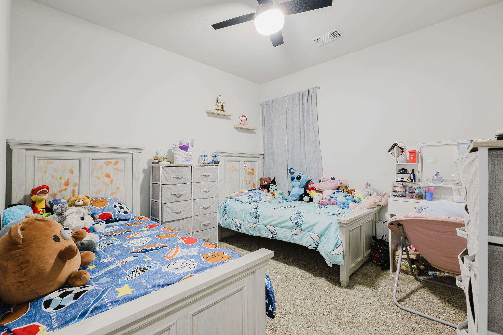 307 Watercourse Way Bastrop, TX 78602 - Photo 19 of 35 a bedroom with furniture a bed and a window