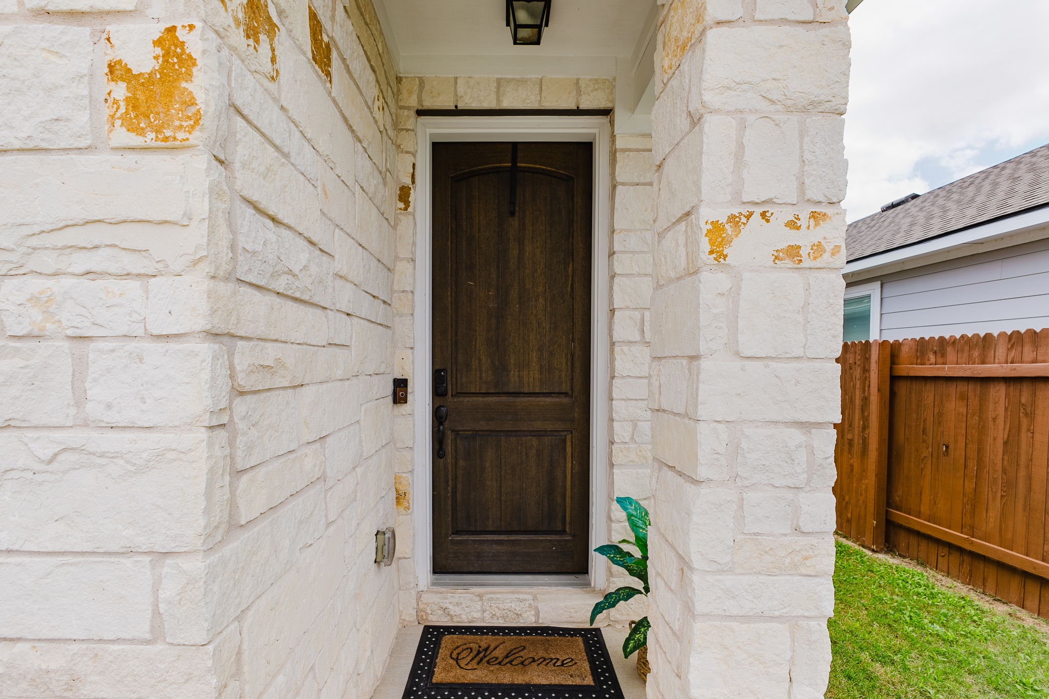 307 Watercourse Way Bastrop, TX 78602 - Photo 28 of 35 a front view of a house with a garage