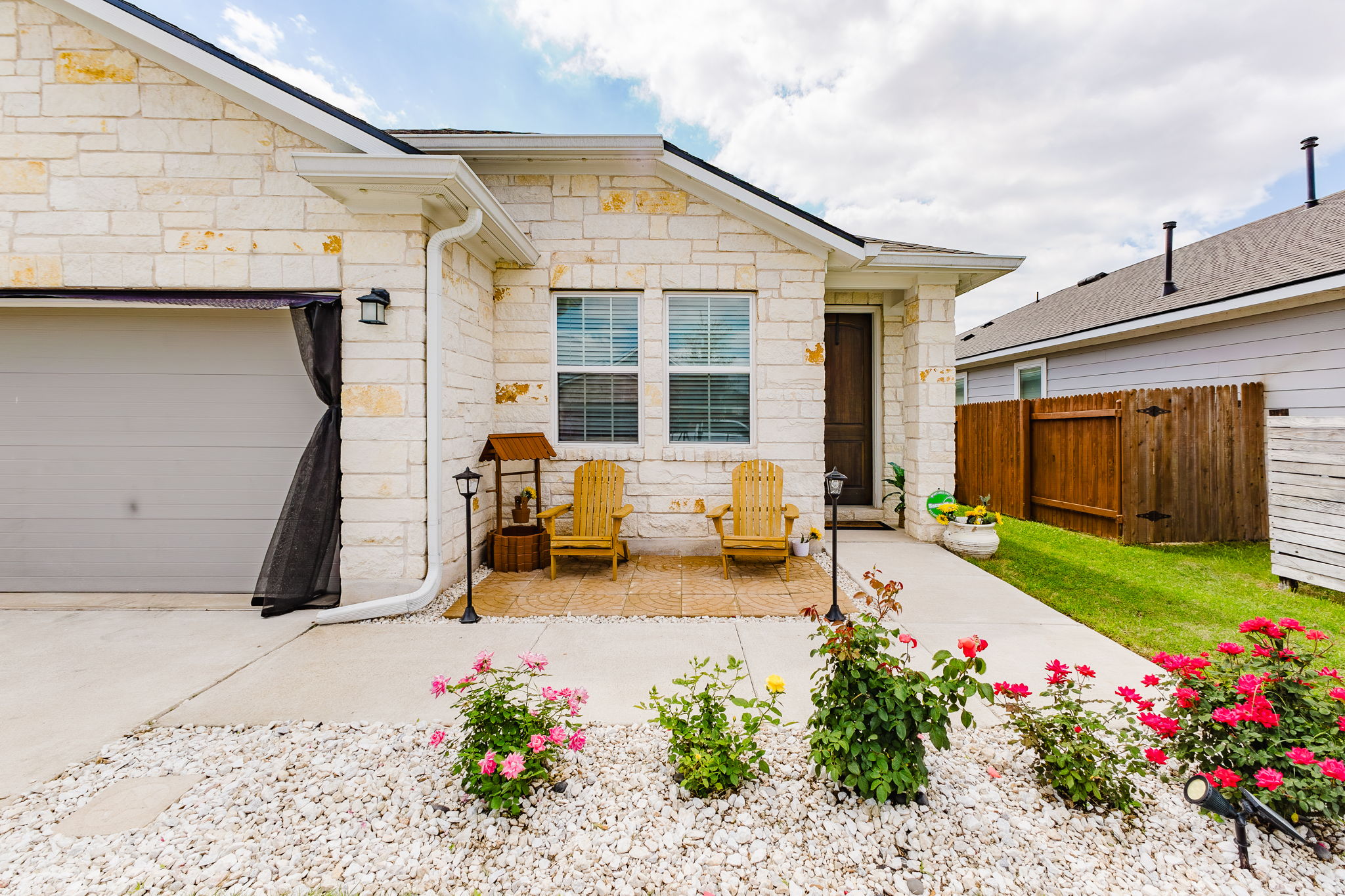 307 Watercourse Way Bastrop, TX 78602 - Photo 29 of 35 a view of a house with chair in the patio