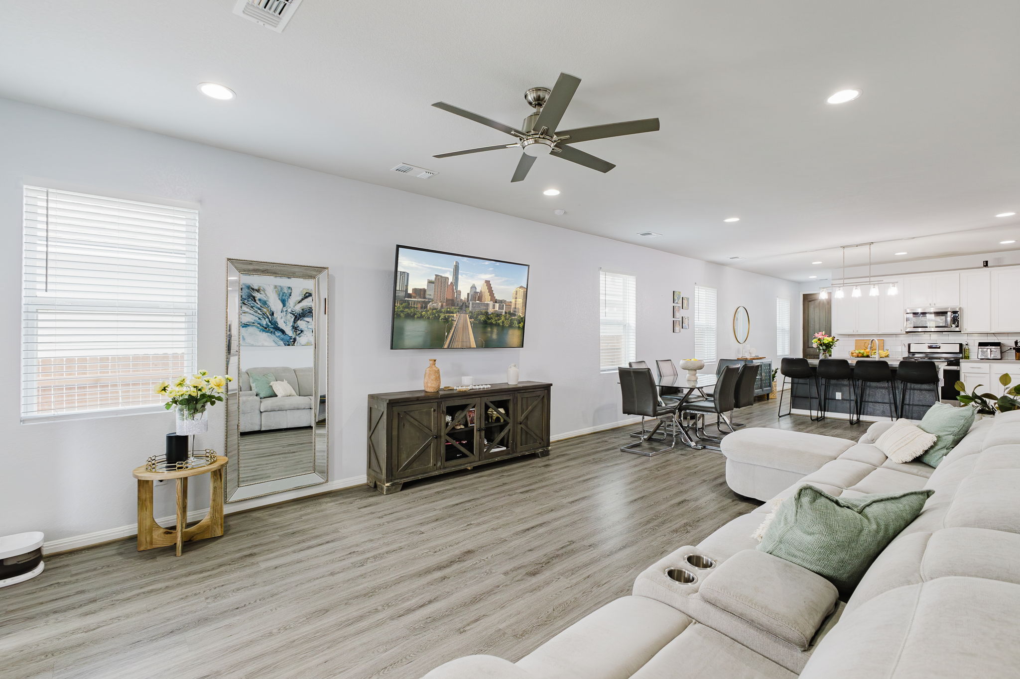 307 Watercourse Way Bastrop, TX 78602 - Photo 10 of 35 a living room with furniture and a wooden floor