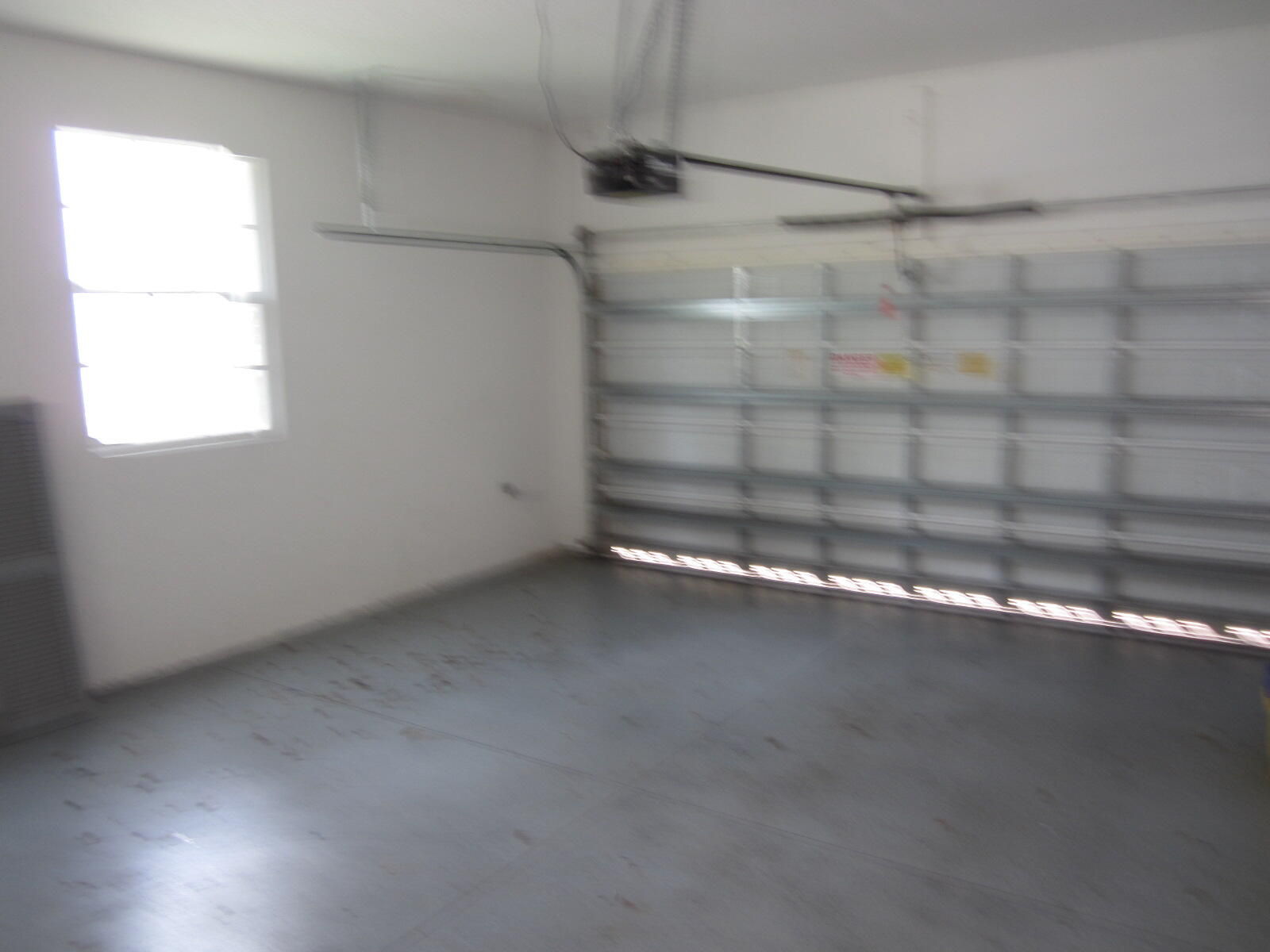 909 Northwest 18th Avenue Boca Raton, FL 33431 - Photo 29 of 39 a view of a room with racks on the wall