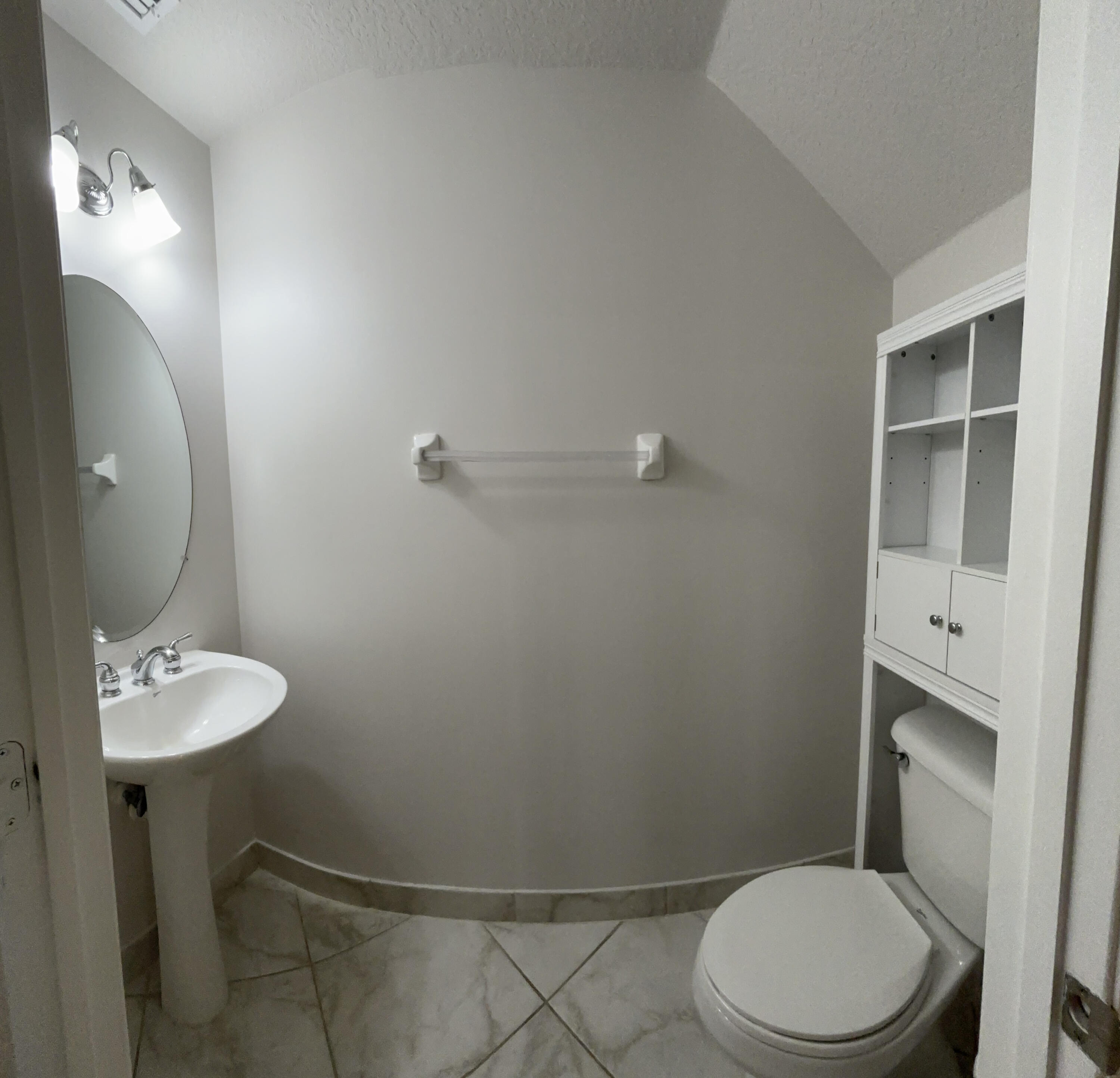 909 Northwest 18th Avenue Boca Raton, FL 33431 - Photo 8 of 39 a bathroom with a toilet a sink and mirror
