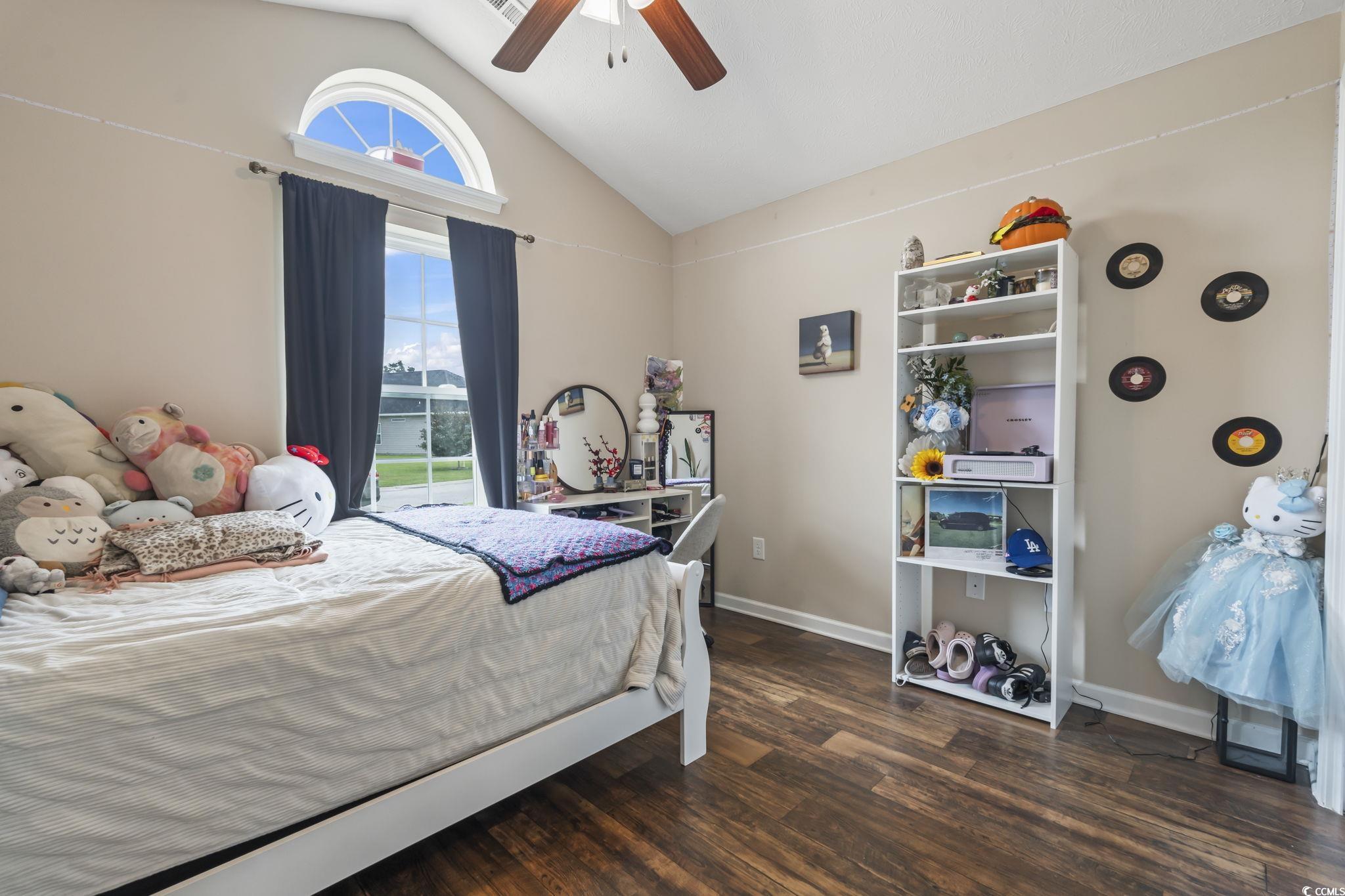 282 Foxpath Loop Myrtle Beach, SC 29588 - Photo 19 of 34 Bedroom featuring wood finished floors, a ceiling fan, baseboards, and high vaulted ceiling