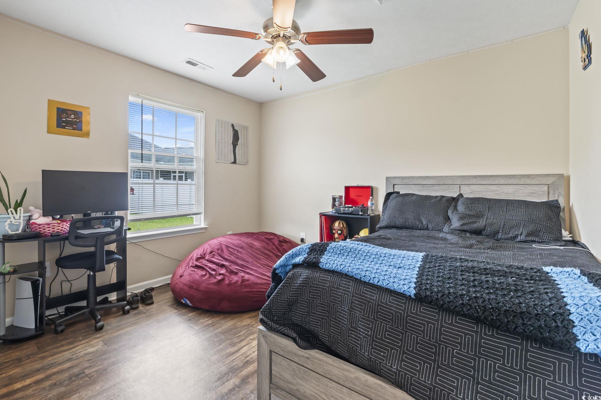 282 Foxpath Loop Myrtle Beach, SC 29588 - Photo 23 of 34 Bedroom featuring wood finished floors, baseboards, and ceiling fan