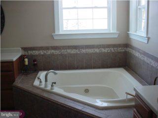 44 Champlain Road Marlton, NJ 08053 - Photo 3 of 6 a bathroom with a tub and a window