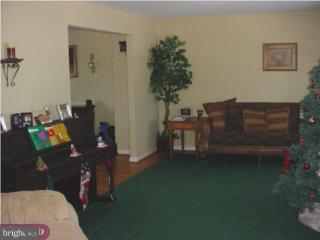 44 Champlain Road Marlton, NJ 08053 - Photo 4 of 6 a living room with furniture and a potted plant