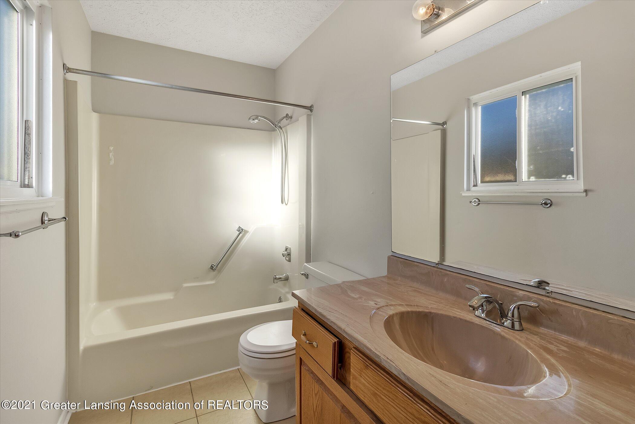 5555 Marsh Road Haslett, MI 48840 - Photo 16 of 34 23-5555-Marsh-Rd-WindowStill-Real-Estate
