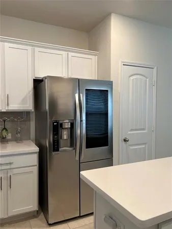 a kitchen with appliances and cabinets