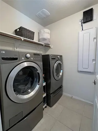 a utility room with dryer and washer