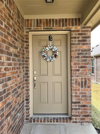 a view of a door with a hallway