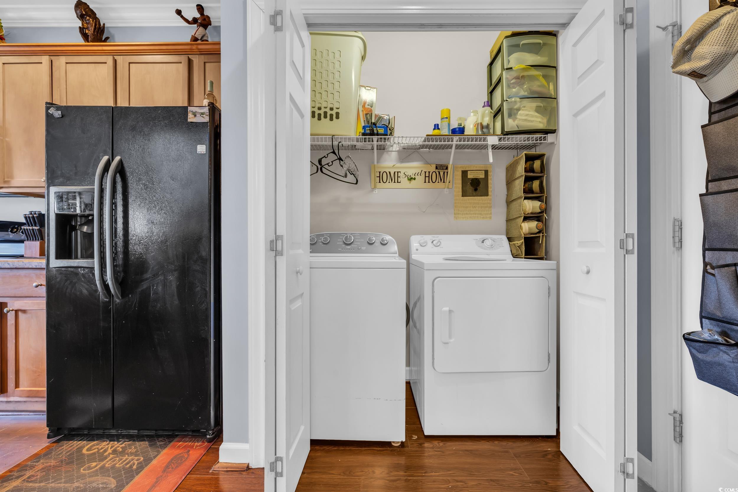 1040 Fairway Lane, Unit 1040 Conway, SC 29526 - Photo 11 of 28 Laundry room featuring dark hardwood / wood-style floors and washer and clothes dryer