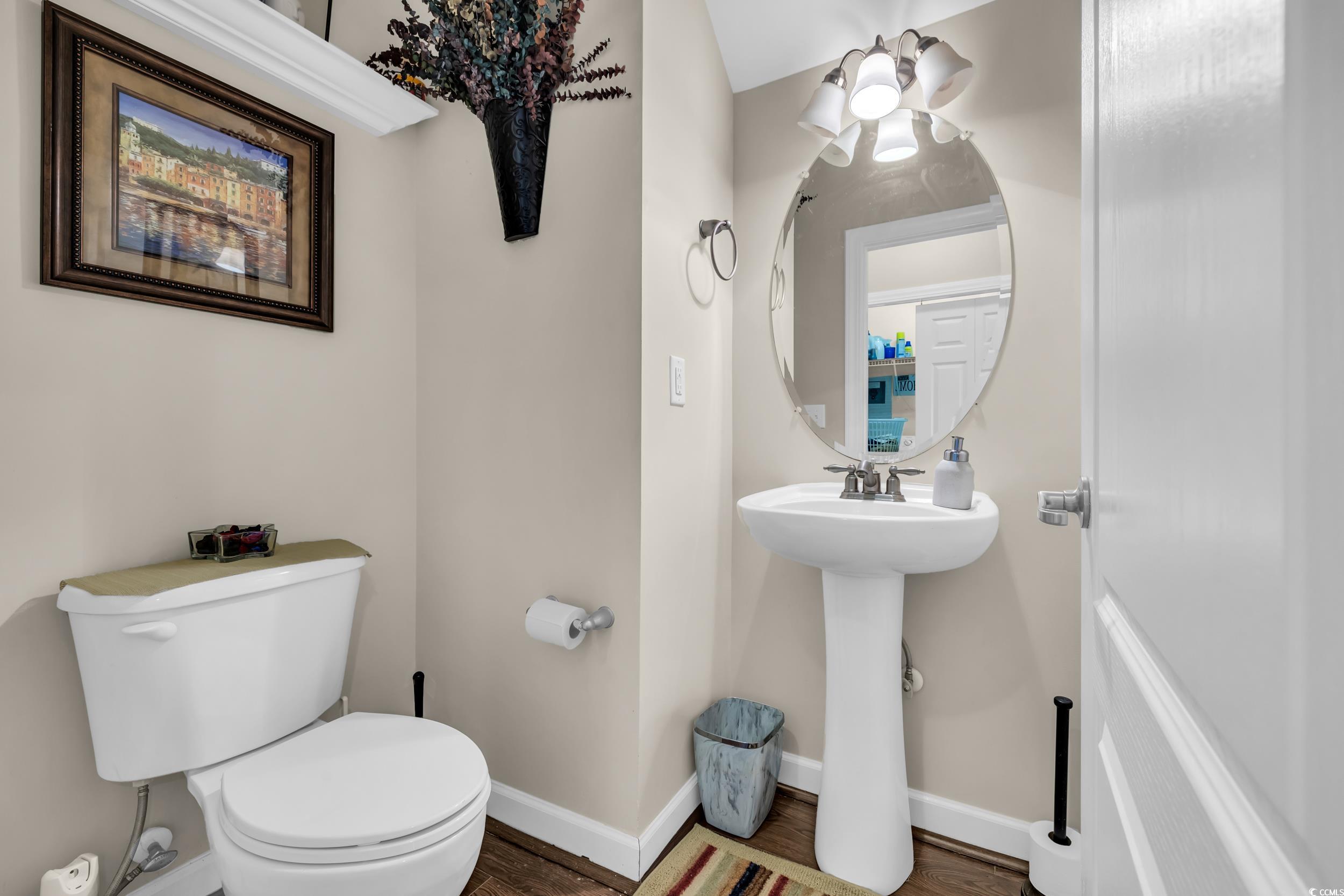 1040 Fairway Lane, Unit 1040 Conway, SC 29526 - Photo 12 of 28 Bathroom with hardwood / wood-style floors and toilet