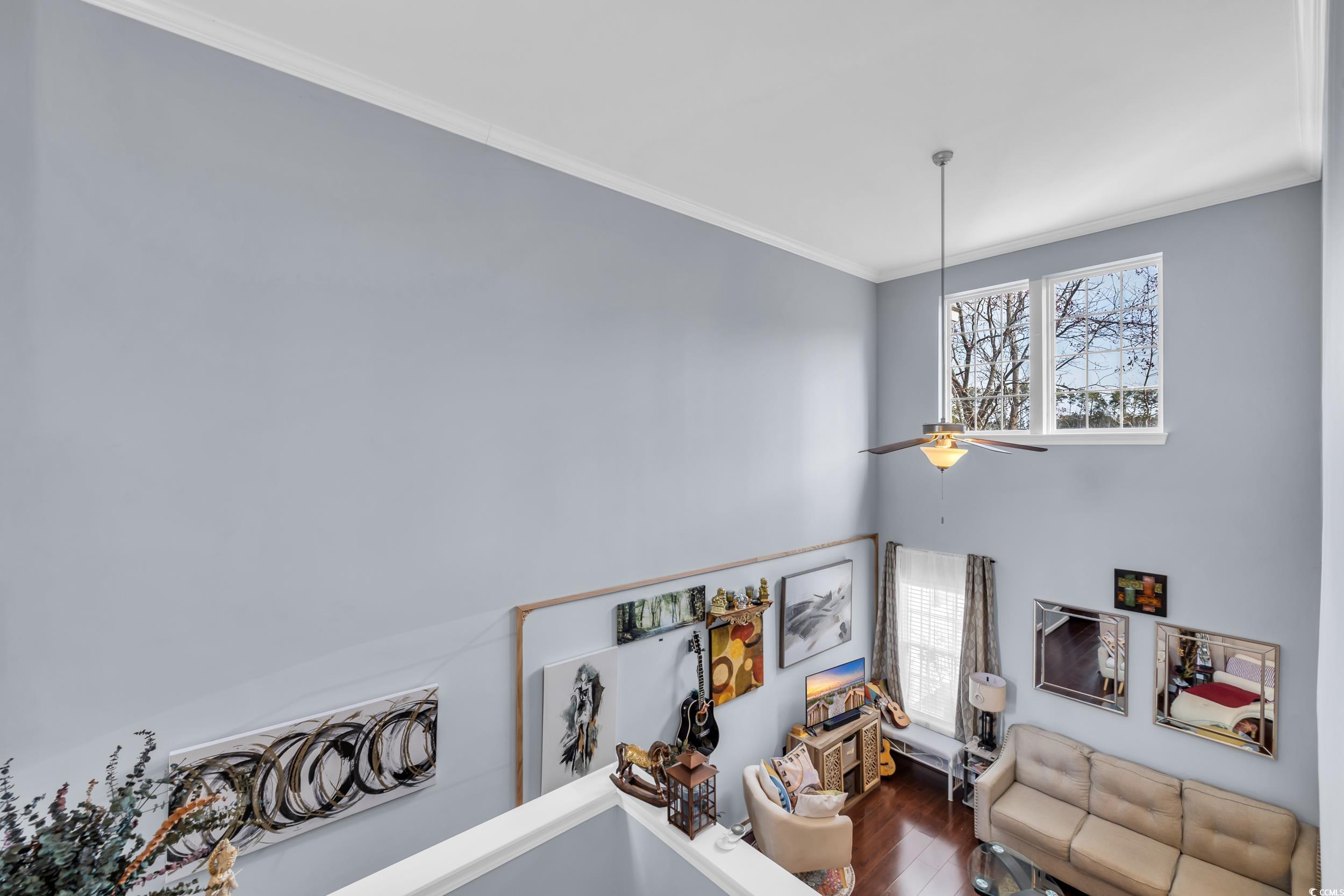 1040 Fairway Lane, Unit 1040 Conway, SC 29526 - Photo 13 of 28 Staircase featuring hardwood / wood-style flooring, ceiling fan, and ornamental molding