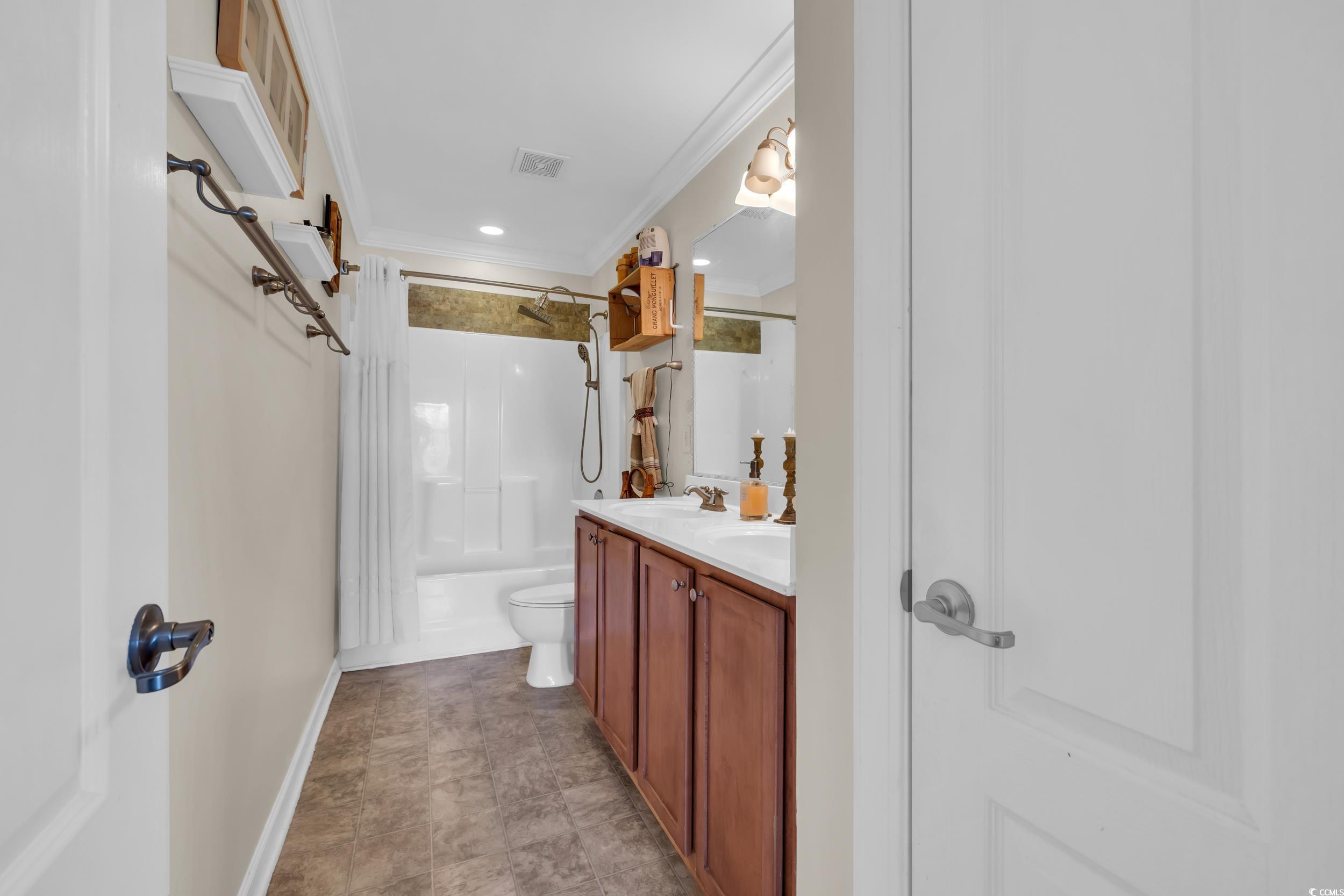 1040 Fairway Lane, Unit 1040 Conway, SC 29526 - Photo 16 of 28 Full bathroom featuring vanity, ornamental molding, toilet, and shower / bath combination