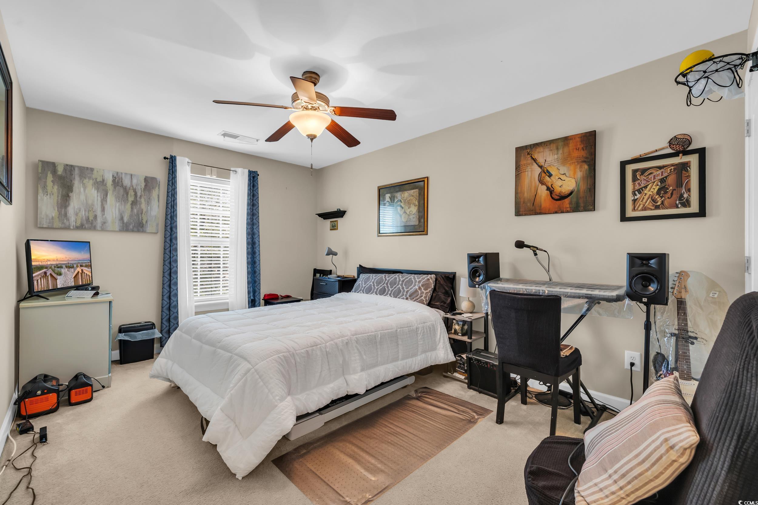 1040 Fairway Lane, Unit 1040 Conway, SC 29526 - Photo 18 of 28 Bedroom featuring ceiling fan and light carpet