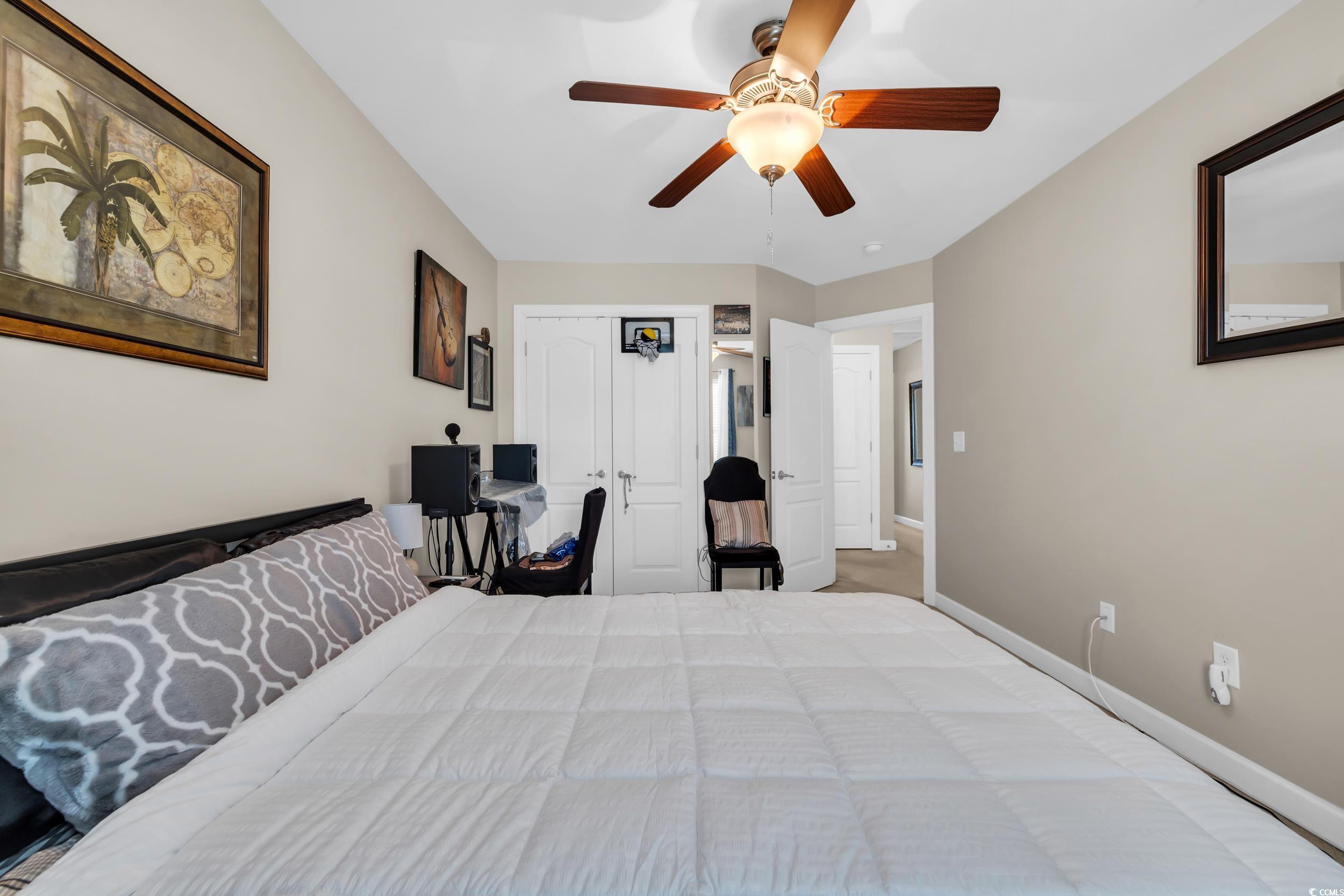1040 Fairway Lane, Unit 1040 Conway, SC 29526 - Photo 19 of 28 Bedroom with ceiling fan and a closet