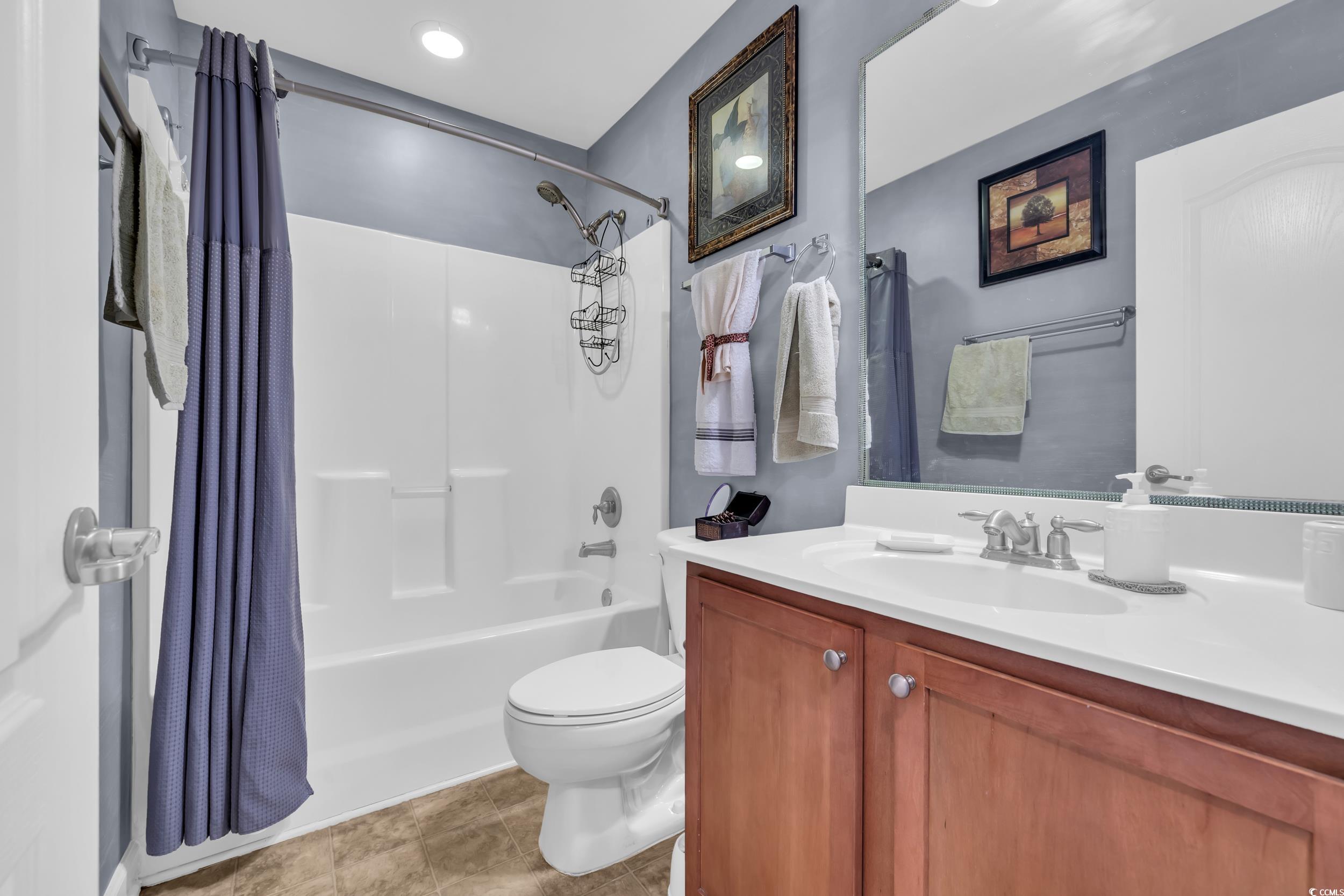 1040 Fairway Lane, Unit 1040 Conway, SC 29526 - Photo 20 of 28 Full bathroom featuring shower / bathtub combination with curtain, vanity, and toilet