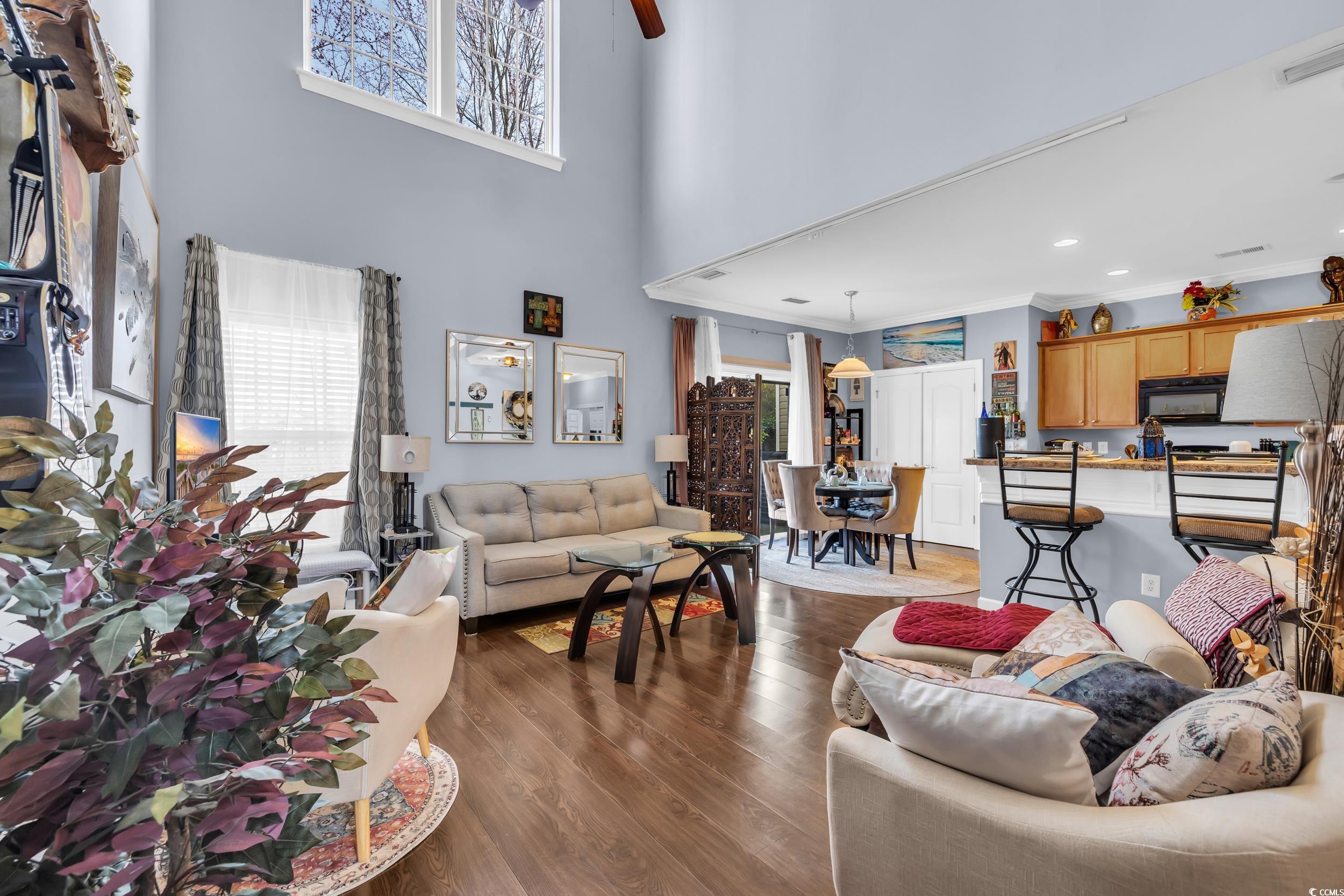 1040 Fairway Lane, Unit 1040 Conway, SC 29526 - Photo 5 of 28 Living room featuring crown molding and hardwood / wood-style flooring