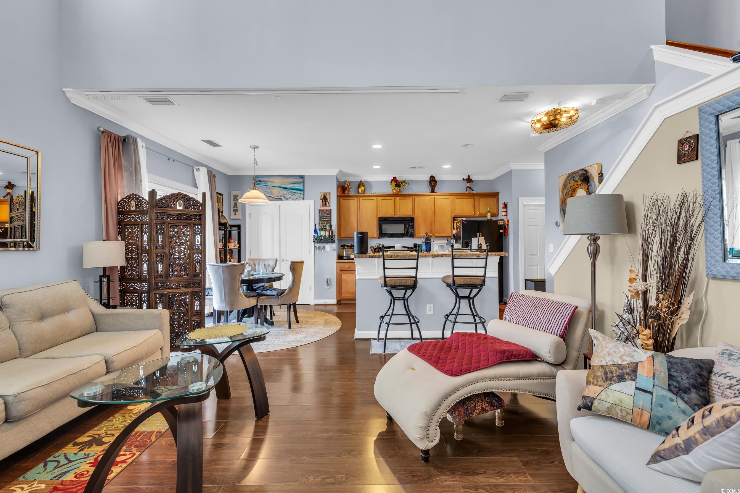 1040 Fairway Lane, Unit 1040 Conway, SC 29526 - Photo 6 of 28 Living room featuring dark hardwood / wood-style flooring and crown molding