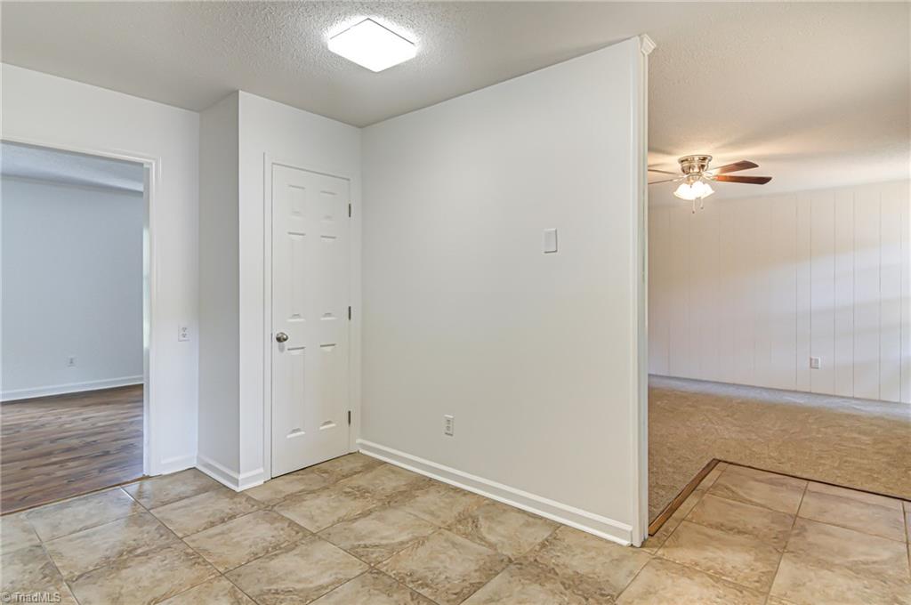 325 Old Mill Road High Point, NC 27265 - Photo 13 of 26 kitchen breakfast area/pantry (viewing living/dining combo and den)