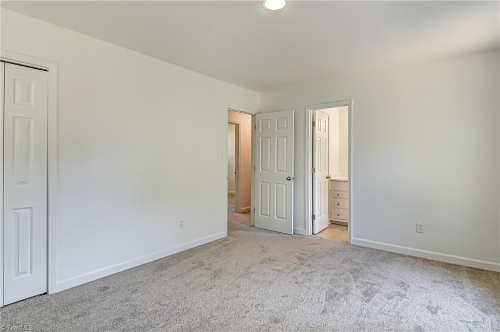325 Old Mill Road High Point, NC 27265 - Photo 19 of 26 Primary bedroom (viewing bathroom and hallway entry)