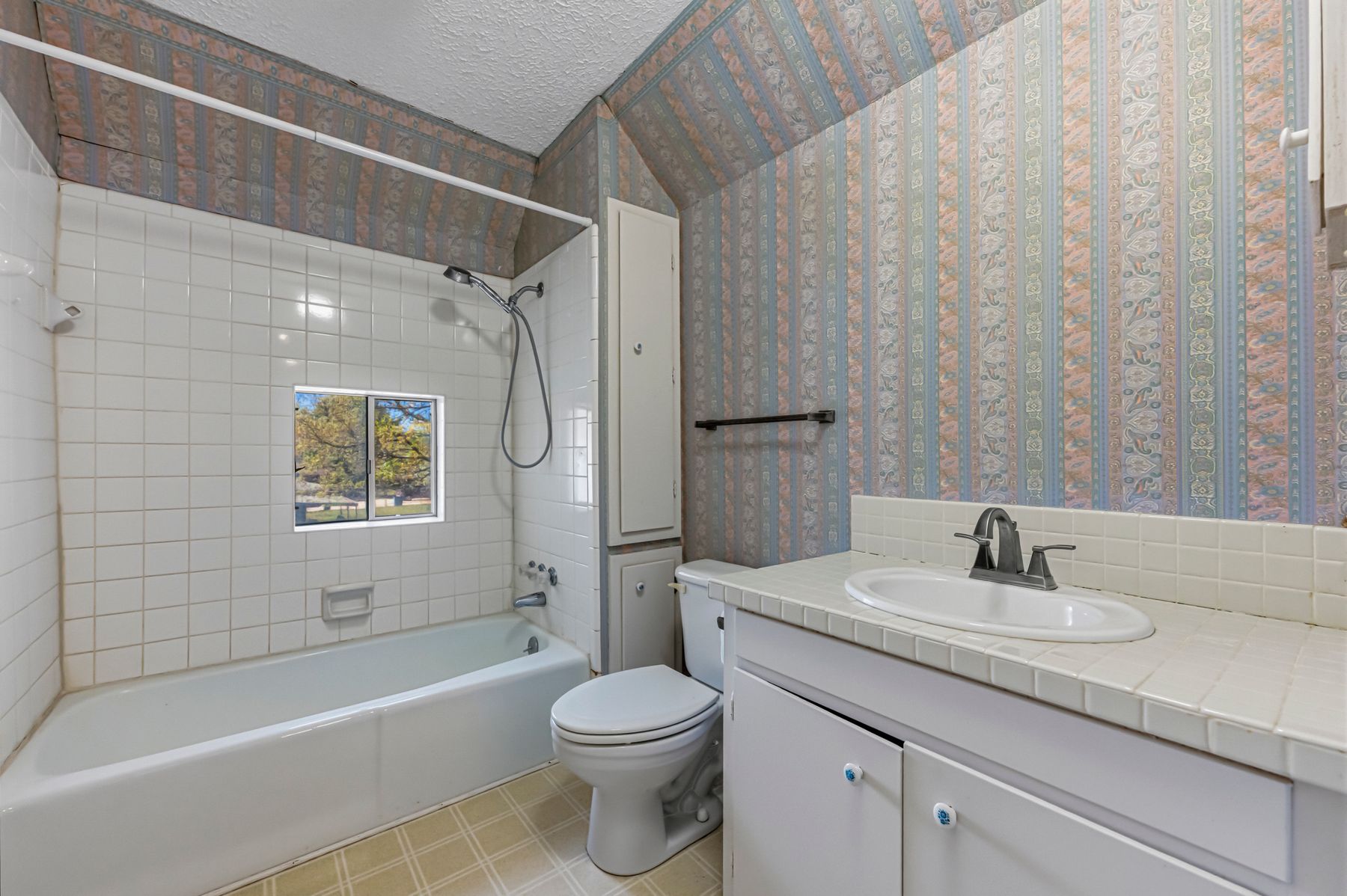 100 West 11th Street Elgin, TX 78621 - Photo 23 of 32 a bathroom with a sink a toilet and shower